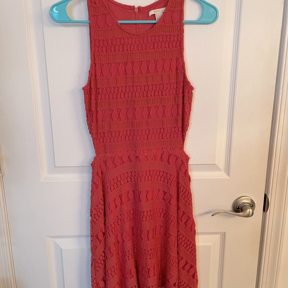 Coral dress with cute cut outs on the side! Like new condition!